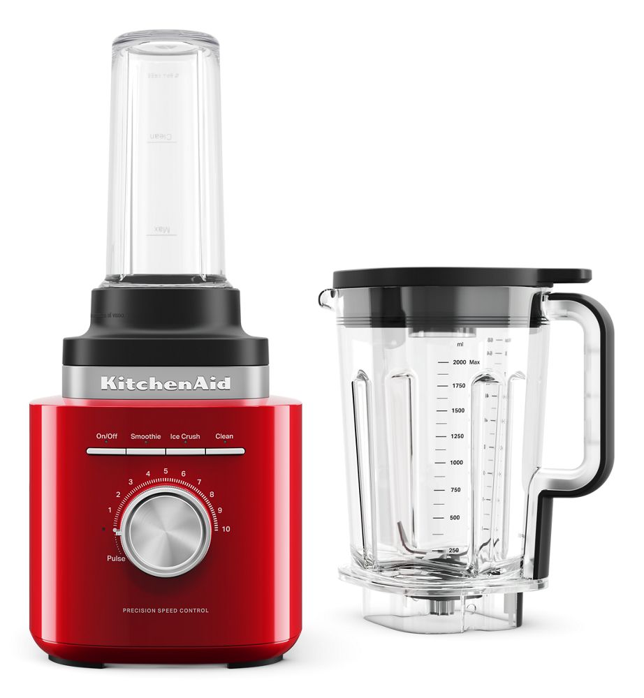 KitchenAid Pure Power KSB2079ER in Empire Red with one personal jar attached and the 68-ounce main jar shown separately.